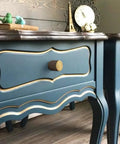 Close-up of vintage blue cabinets with 6 Pack Antique Brass Cabinet Knobs Set With Zinc Alloy Construction installed on drawers.