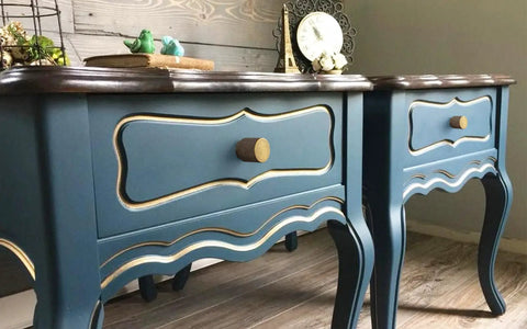 Close-up of vintage blue cabinets with 6 Pack Antique Brass Cabinet Knobs Set With Zinc Alloy Construction installed on drawers.