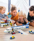 Family building 880 Piece City Airport Terminal Building Set, 6 In 1 Airplane Building Blocks Toy with children engaged