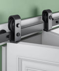 Close-up of 40 Inch Bifold Sliding Barn Door Hardware Kit For Double 18 Inch Doors, Top Mount Bi Folding Track Set, installed view