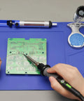 60W Soldering Iron Kit With Temperature Control, Three LED Work Lights, Five Premium Tips, Desoldering Pump shown in use on circuit board