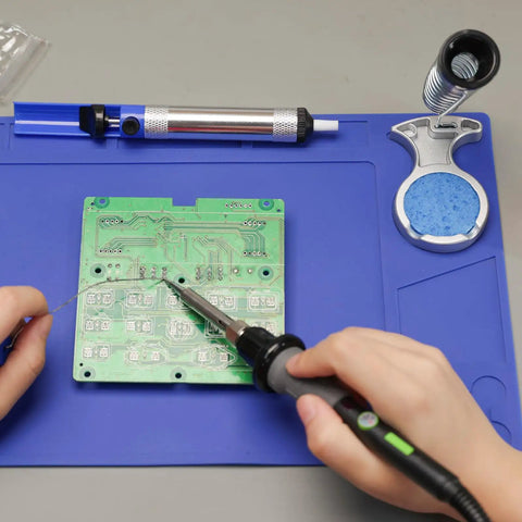 60W Soldering Iron Kit With Temperature Control, Three LED Work Lights, Five Premium Tips, Desoldering Pump shown in use on circuit board