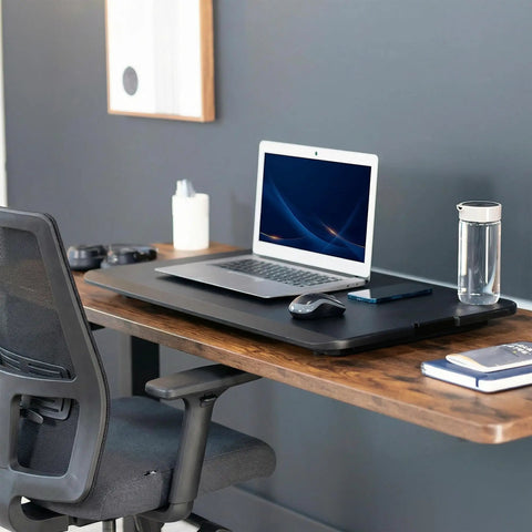 Budget Friendly 29 Inch Height Adjustable Standing Desk Converter for sit stand workstation with laptop and mouse on top.
