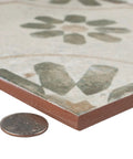 Blume Sage Ceramic Floor And Wall Tile 17.63 In Square Glazed with Subtle Texture shown with coin for scale
