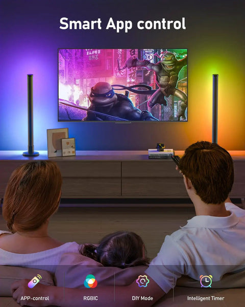 Family enjoying TV with Dope RGB LED Light Bar for TV and PC Backlighting with Bluetooth App Control and Music Sync, showing multicolor scene.