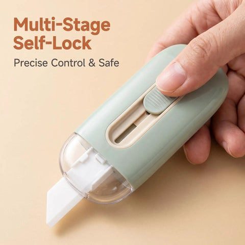 Grab-And-Go Safe Ceramic Box Cutter With Retractable Blade Mini Package Opener For Home Office And Warehouse Use Lightweight Ergonomic Green Tool close-up, self-lock switch