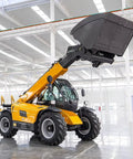 Heavy Duty Four Wheel Drive Telehandler Forklift in a warehouse with telescopic boom raised for loading tasks.