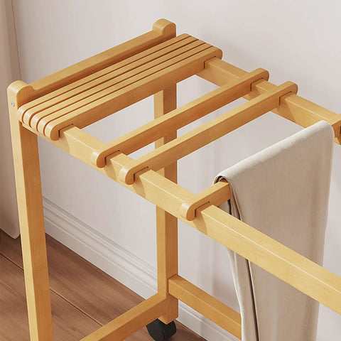 Top Shelf Rolling Clothes Rack Featuring Heavy Duty Swivel Wheels And Sturdy Natural Wood Slats Designed For Effortless Trouser Storage Within Any Spacious Bedroom Or Small Living Area