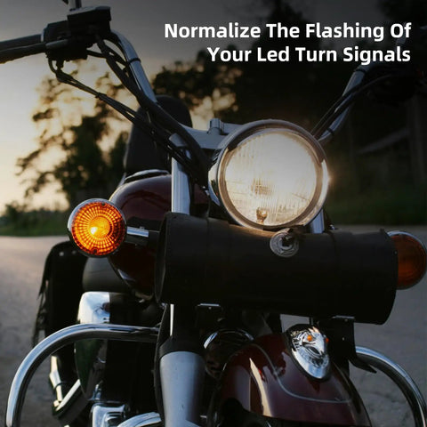 Harley compatible LED turn signal load equalizer and stabilizer installed on motorcycle, keeping signals solid, no flashing issues.