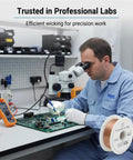 Technician using Desoldering Solder Wick Braid Tool With No Clean Flux Core for PCB under microscope in lab.
