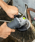 Beast 4.0 Amp 520W Corded Angle Grinder, 4-1/2 Inch, 12000 RPM with cutting and grinding wheels in use on metal pipe