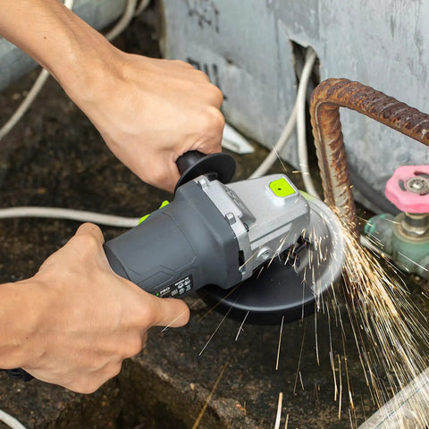 Beast 4.0 Amp 520W Corded Angle Grinder, 4-1/2 Inch, 12000 RPM with cutting and grinding wheels in use on metal pipe