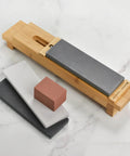 Zwilling 3000 Grit Glass Water Sharpening Stone For Ultra Fast Grinding And Ultra Low Wear with accessory stones on marble surface.