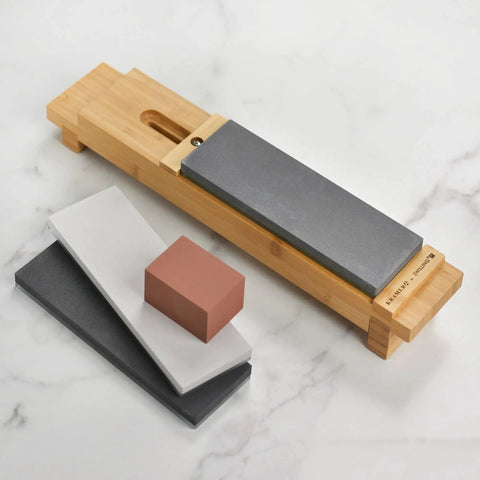 Zwilling 3000 Grit Glass Water Sharpening Stone For Ultra Fast Grinding And Ultra Low Wear with accessory stones on marble surface.