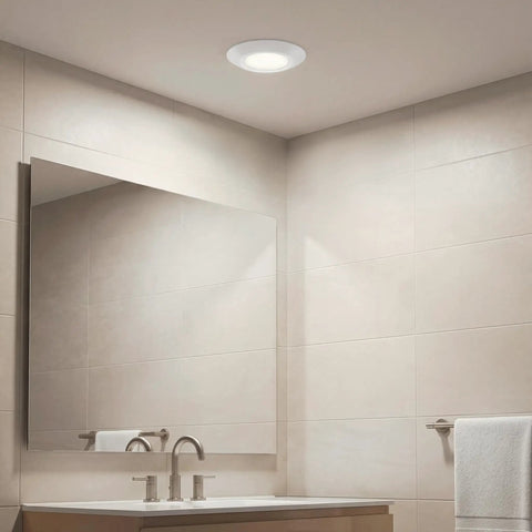 6.4 Inch Led Flush Mount Ceiling Light White Finish Delivers 1000 Lumens lighting a modern bathroom with mirror.
