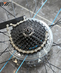 Close-up of Go To Bike Chain Whip And Sprocket Remover For Cassette And Freewheel Removal Works With 5 To 10 Speed Road And Mountain Cassettes Also Fits Single Speed With 3 32nd Inch Cog Essential Bike Maintenance Tool on a bicycle wheel showing the sprocket engagement.