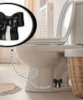 Black Coquette Bow Toilet Bolt Covers Set Of Two - Durable Ceramic Screw Nut Caps For Bathrooms on a toilet.