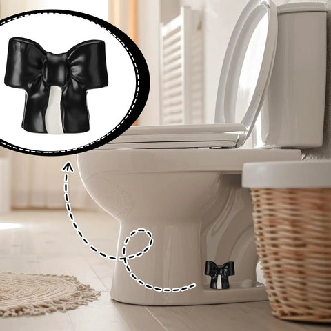 Black Coquette Bow Toilet Bolt Covers Set Of Two - Durable Ceramic Screw Nut Caps For Bathrooms on a toilet.