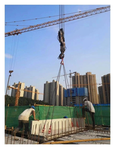 Precast Concrete Lifting Clutch With Steel Lifting Ring lifting panel on construction site with cranes and workers visible