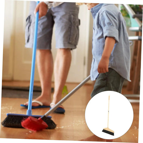 Straight Up Solid Horsehair Broom With Long Grippy Handle And Soft Pine Bristles used by a person and child for cleaning hardwood floor.