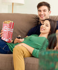 Couple on sofa with Heavy Duty Paper Popcorn Bags 1 Oz Individual Servings 500 Pack For Popcorn Machines Small Mini Bags.