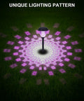 8 Pack Solar Pathway Lights With Warm White And 7 Color Changing Modes illuminating a lawn with unique purple patterns