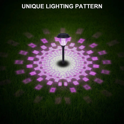 8 Pack Solar Pathway Lights With Warm White And 7 Color Changing Modes illuminating a lawn with unique purple patterns