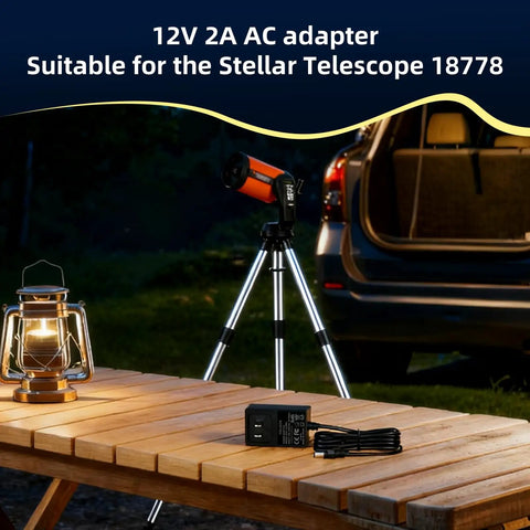 Universal 2 Amp AC Adapter For Computerized Telescopes Replacement Power Supply on wooden table with telescope and lantern.