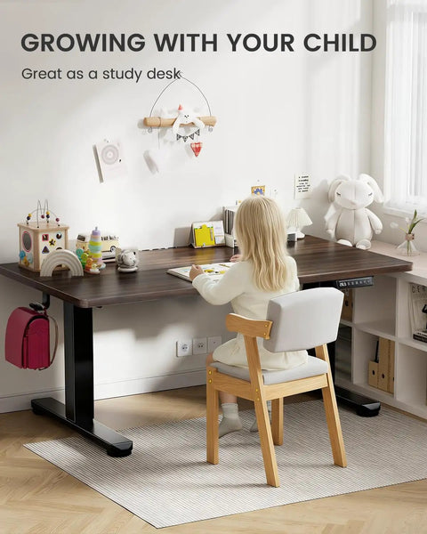 Top Notch ErGear Low Height Adjustable Electric Standing Desk 48 X 24 Inches For Kids with a child studying at home.