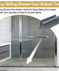 Gray Sliding Shower Door Bottom Guide With Slick Roller Track For Standard Glass Doors Up To Five Sixteenth Inch Thickness, installed in a modern bathroom.