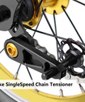 Lightweight Aluminum Alloy Single Speed Chain Tensioner For Bikes Durable CNC Machined Chain Stabilizer Tool To Prevent Chain Drop During Rides Black Finish shown installed on bike wheel.
