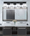 Black Bathroom Vanity Light Fixture With Crystal Accents above a modern dual sink bathroom vanity with a large mirror.