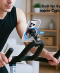 Ultra Strong Magnetic Phone Holder Clamp Mount on gym bike handlebar with iPhone set at 360° rotation for indoor cycling.