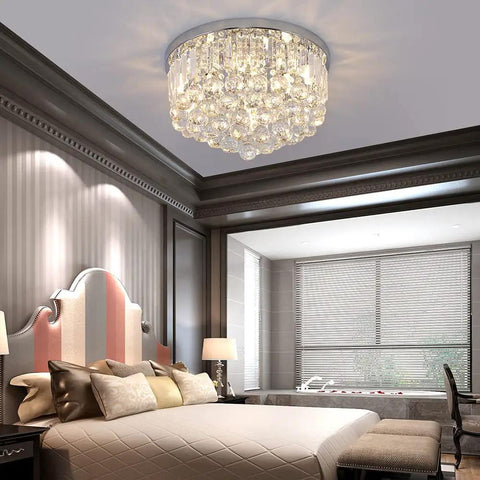 Lit Crystal Raindrop Chandelier Flush Mount Ceiling Light With G9 Base Modern K9 Crystal Beads Chrome Finish in stylish bedroom.