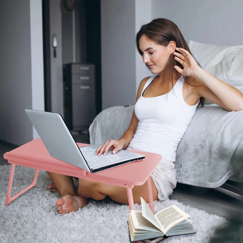 Woman using laptop on Multiuse Bed Lap Desk With Tilted Angles For Laptops Foldable Portable Bed Table in candy pink
