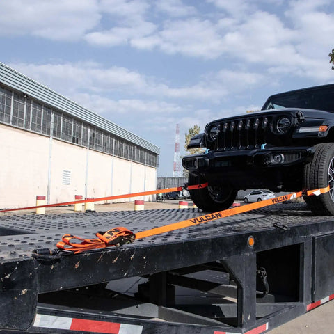 ProSeries Beefy Axle Strap Tie Down Kit With Wire Hook Ratchet Straps securing black SUV on flatbed.