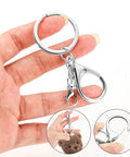 Top Shelf Zinc Alloy Lobster Clasps And Keyrings 10 Pack Badass Heavy Duty Keychain Kit showing keyring in hand with lobster clasp.