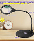 Desk Magnifying Lamp With 10X 20X Glasses Hands Free Stand Lighted Magnifier on wooden desk with flexible arm and base.