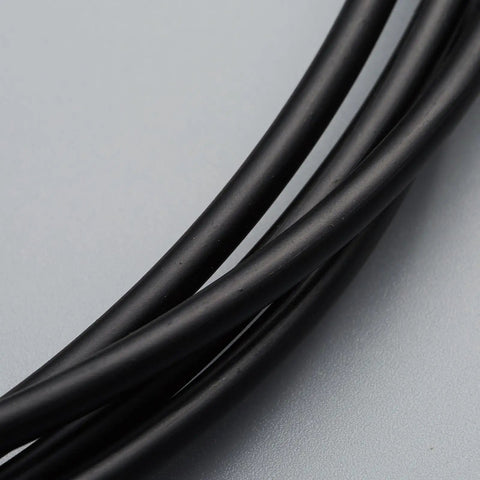 Close-up of black cables from the Universal Bicycle Shifter Cable Housing Set For Derailleur Systems Durable Black Upgrade Kit