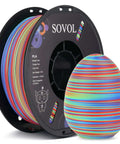 Rotated Tri Color Dope Coextruded PLA Filament 1.75mm 1kg 2.2lb Matte Finish Red Green Blue spool with colorful 3D printed egg