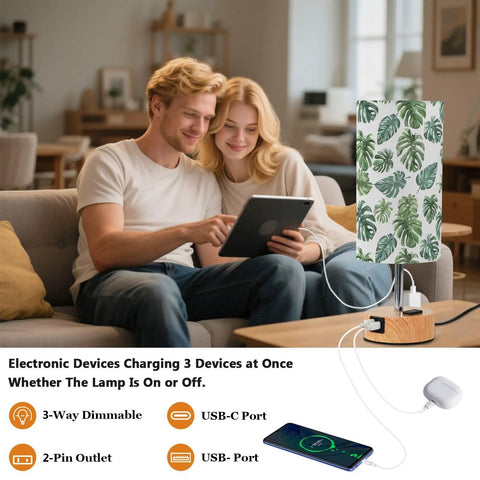 Palm Leaves Watercolor Bedside Table Lamp With 3-Way Dimming And Touch Control, Built-In Charging Station shown in use