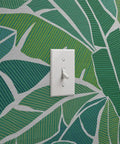 Heavy Duty Tropical Leaf Exotic Textured Vinyl Wallpaper with slick leather finish, green pattern and light switch, 2 x 27 ft.