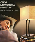 Woman relaxing with Set of 2 Touch Control Table Lamps With 3 Way Dimmable Lighting USB Ports for Quick Charging Cream Fabric Shade