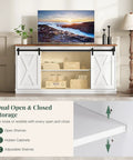 Slick Farmhouse TV Stand For 65 Inch Flat Screen Television Featuring Smooth Sliding Barn Doors And Creamy Milk White Finish, showcasing dual open and closed storage.