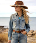 Young woman wearing Top Shelf Bolo Tie Set 8 Piece Adjustable Western Leather Neckties With Turquoise Conchos at the beach.