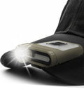 Tan Ultra Lightweight Clip On Cap Light 65A Plus USB C Rechargeable 230 Lumen LED Compact Headlamp attached to black cap