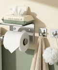 Stainless Steel Toilet Paper Holder With Built In Phone Shelf And Towel Hooks Adhesive Or Screw Mount Wall Mounted Bathroom Tissue Roll Organizer In Polished Chrome with aqua wipes on shelf and towel hanging