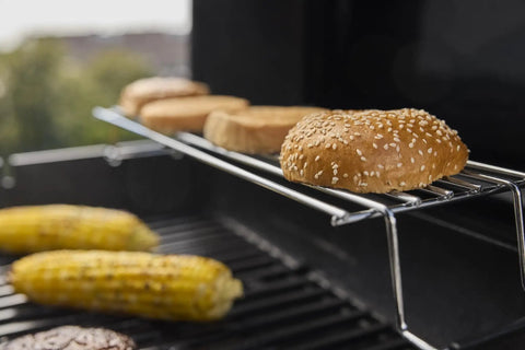 E-325 Propane Gas Grill With 3 Burners And 2 Boost Burners, Bold Sear Zone Heat, grilling burger buns and corn on grates