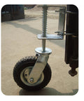 Close-up of Smooth As Butter 8 Inch Pneumatic Rubber Gate Wheel With Spring Suspension mounted on a gate for easy rolling.