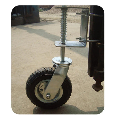 Close-up of Smooth As Butter 8 Inch Pneumatic Rubber Gate Wheel With Spring Suspension mounted on a gate for easy rolling.
